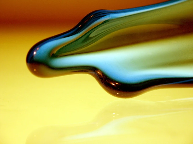 an abstract picture of blue and yellow glass