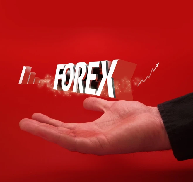 two hands with fingers holding the word forex over a red background