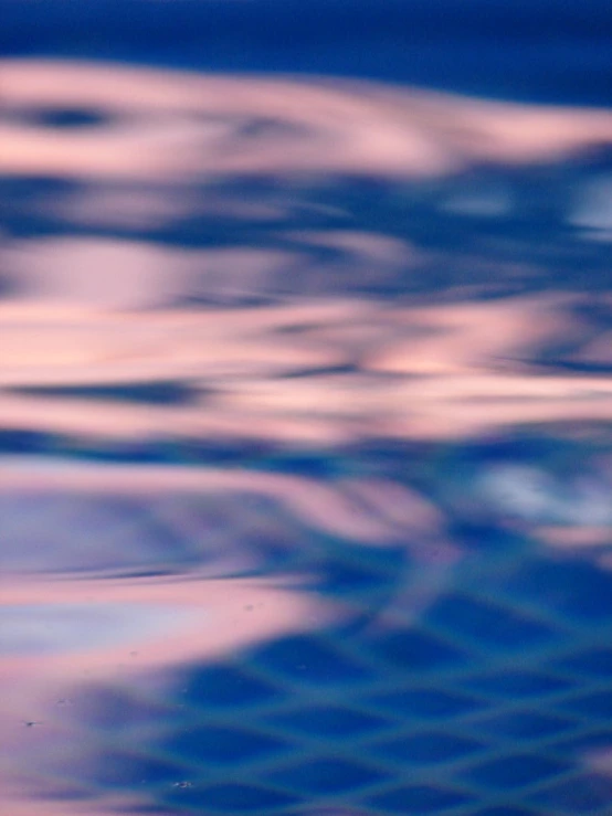 a blurry image shows blue and brown colors in the water