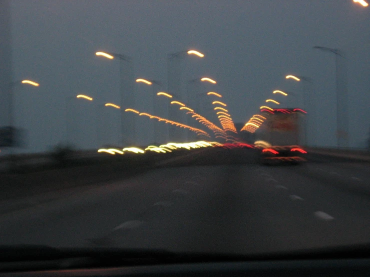fireworks fly through the sky in a highway at night