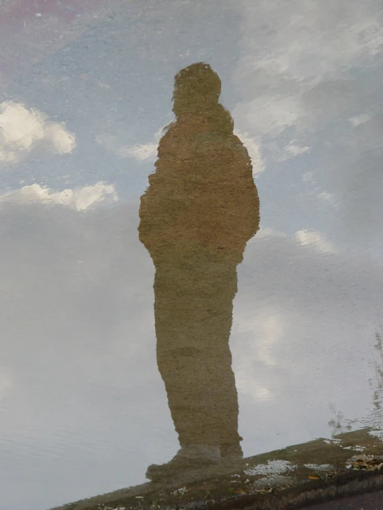 a man is shown standing on the top of a stone surface