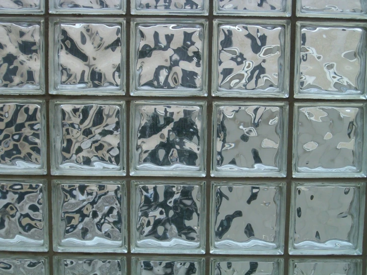 a glass block with some different black and white designs