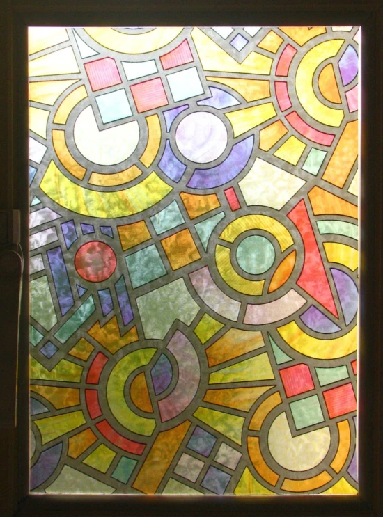 a stained glass window with colorful and abstract designs