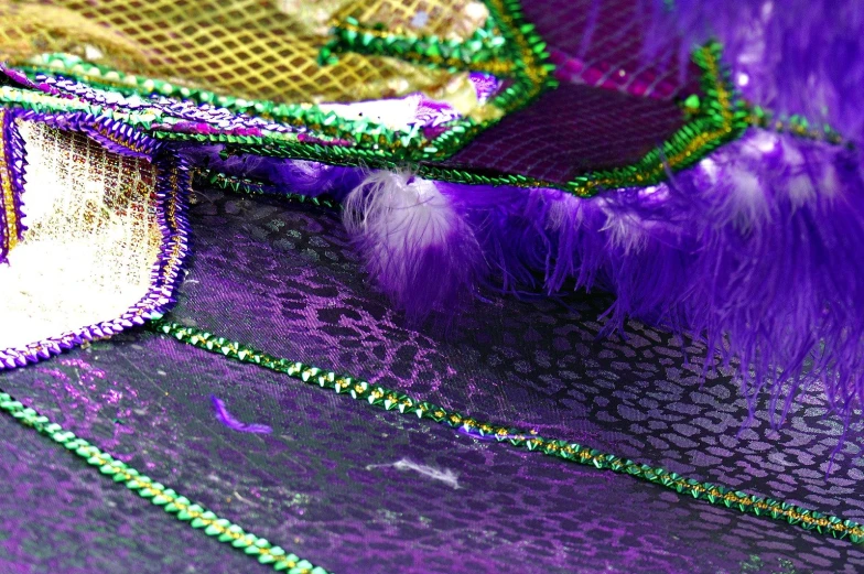 a purple and green color block pattern of mesh and fabric