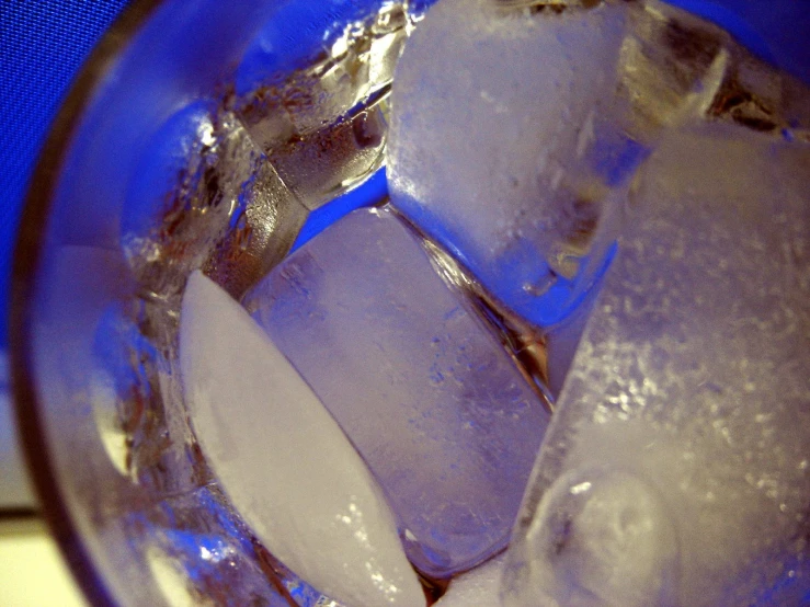 several ices are in an ice bucket with water