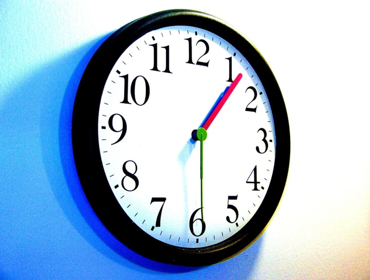a wall clock that has been altered to read the time