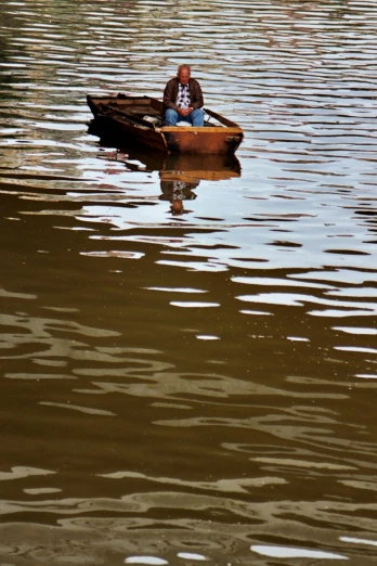 a man that is sitting in a boat