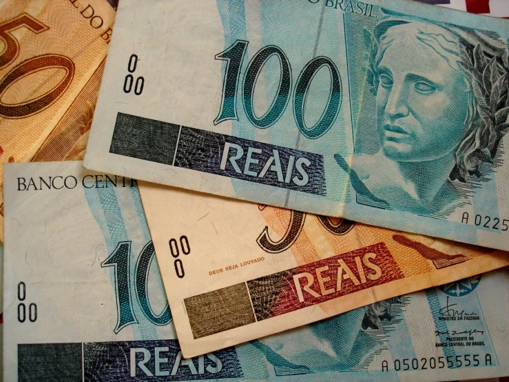five mexican currency notes are on the table