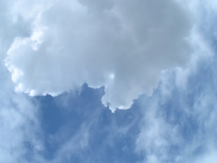 a group of clouds in a blue sky