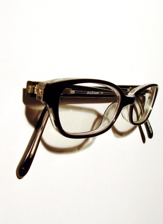 a pair of glasses sitting on top of a table