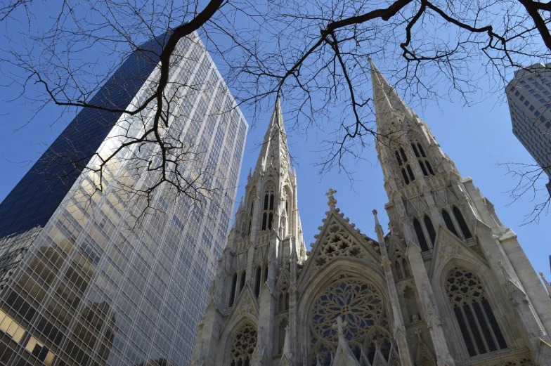 some very tall buildings in a city and one of them is clear