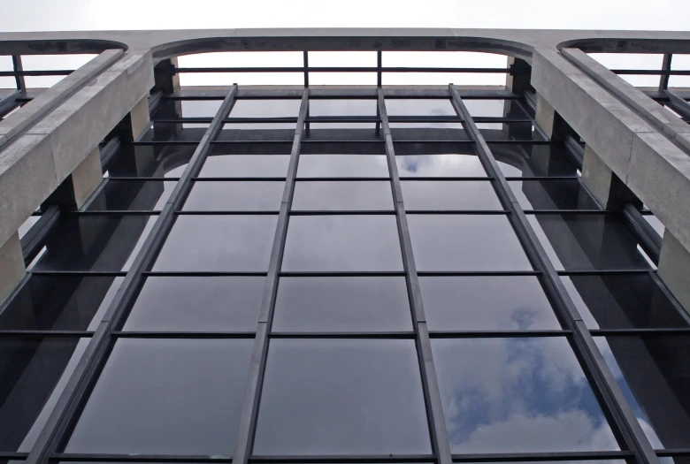 a view of the windows on a building, from below