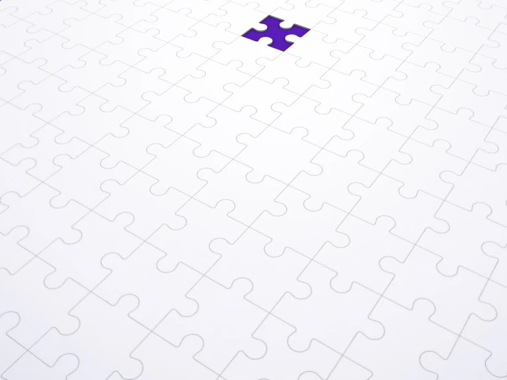 a purple piece of puzzle on top of a white paper