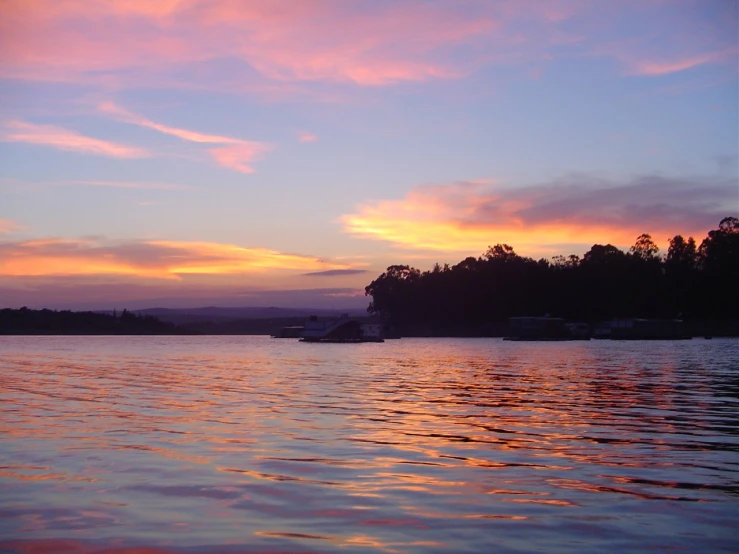 an image of the sunset in the water