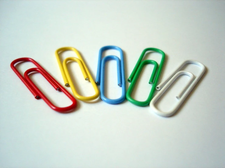 four office paper clips sit side by side