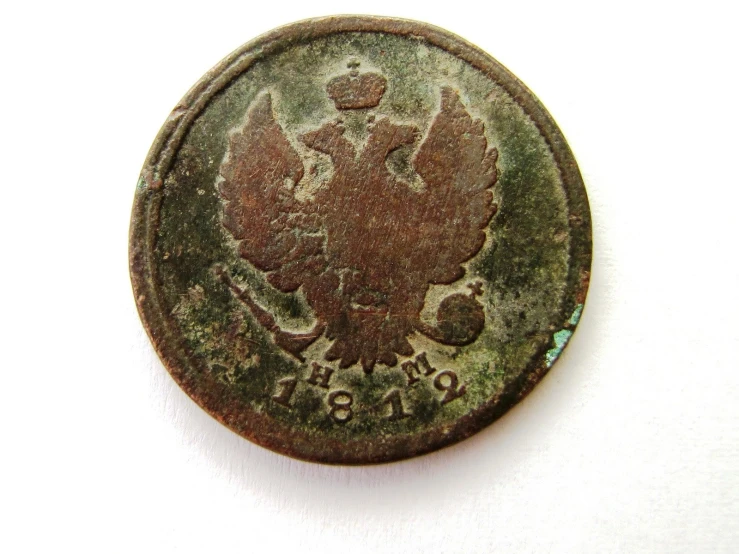 an old coin has an intricate design on it