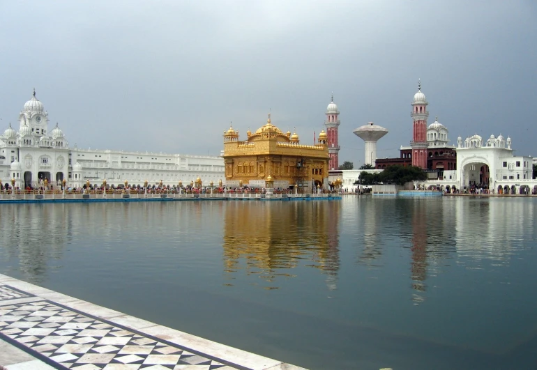 a pond with people on the front side of it