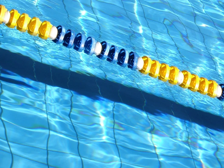 a pool with water blue and yellow tape in it