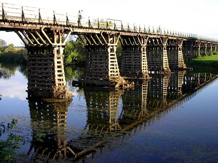 a bridge that has lots of wooden railings