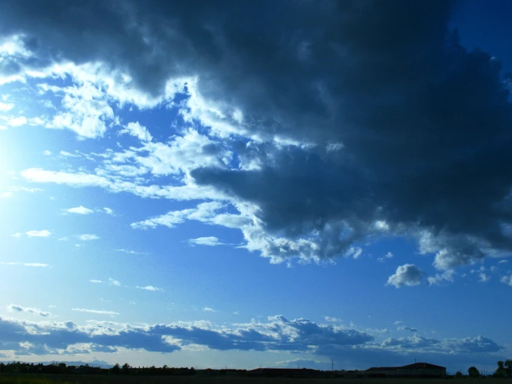 an image of a sky with some clouds and blue skies