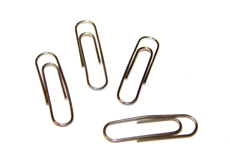 three paper clips sitting on top of each other