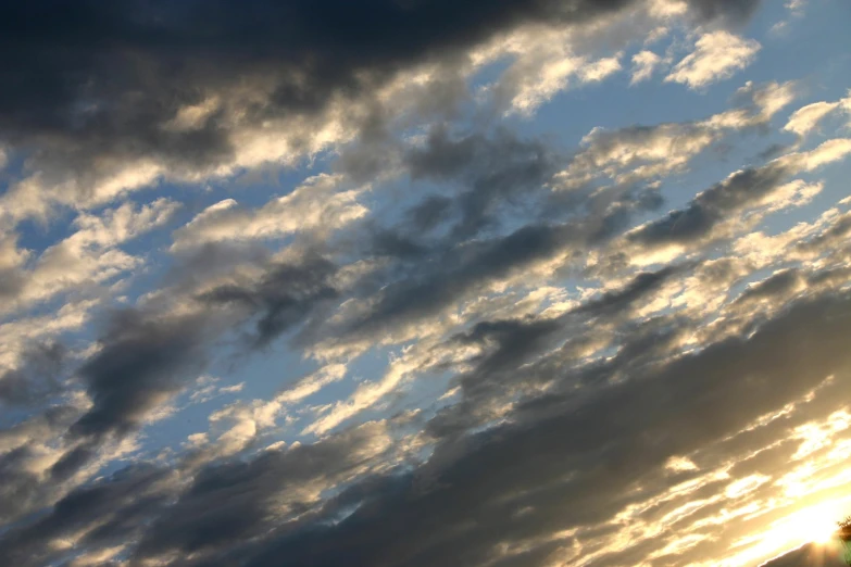 the cloudy sky with some planes in it