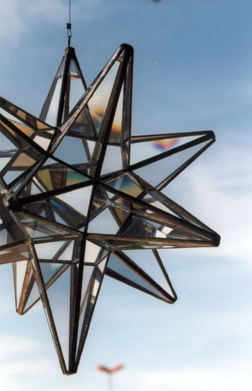 a star shaped object that has been made out of cds