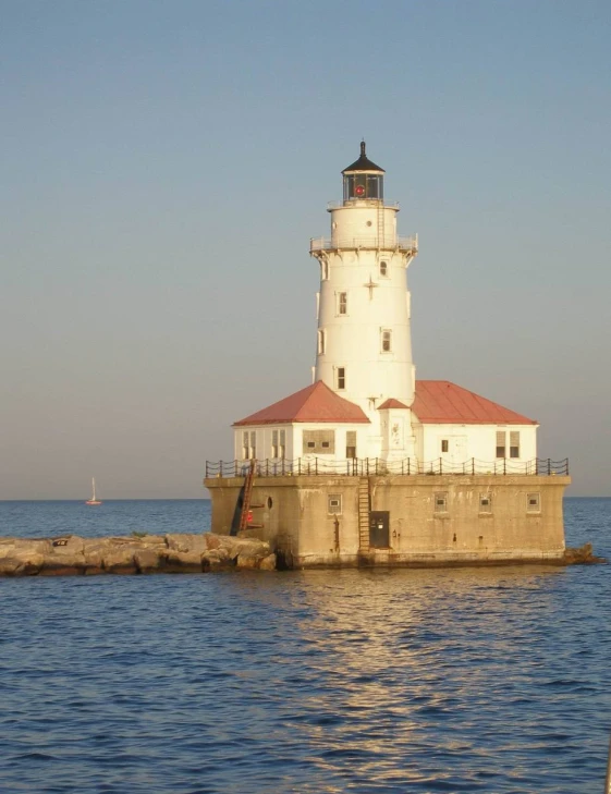 a light house on the side of a body of water