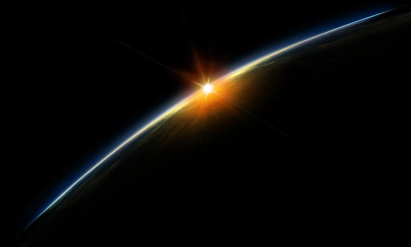 the earth's horizon from space with the sun shining above it
