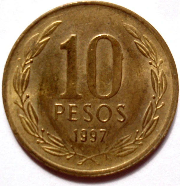 an older spanish 10 peso coin in the shape of the number ten