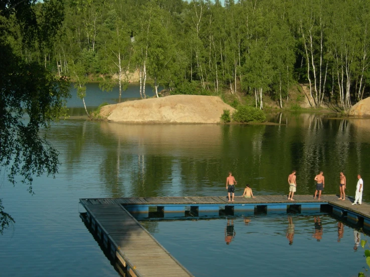 people that are on a dock in the water