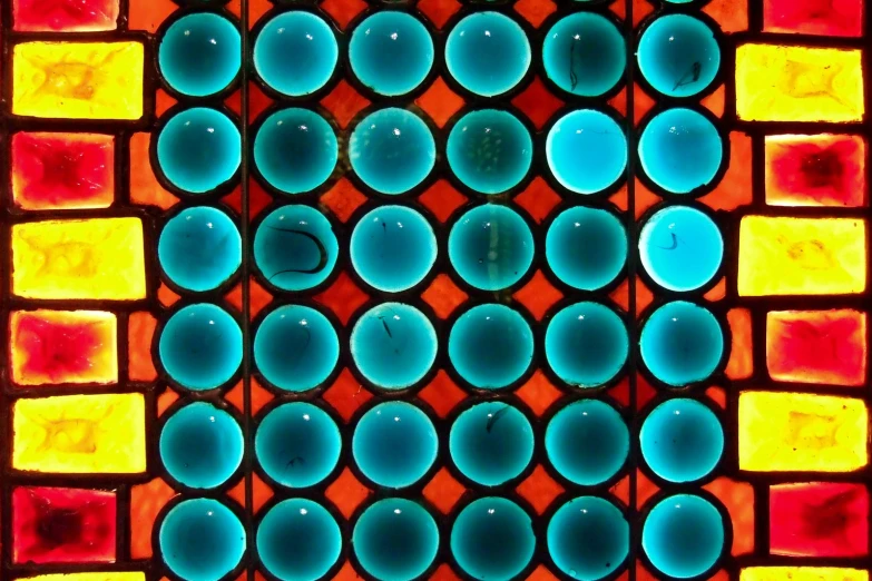 some kind of pattern with colored squares and circles