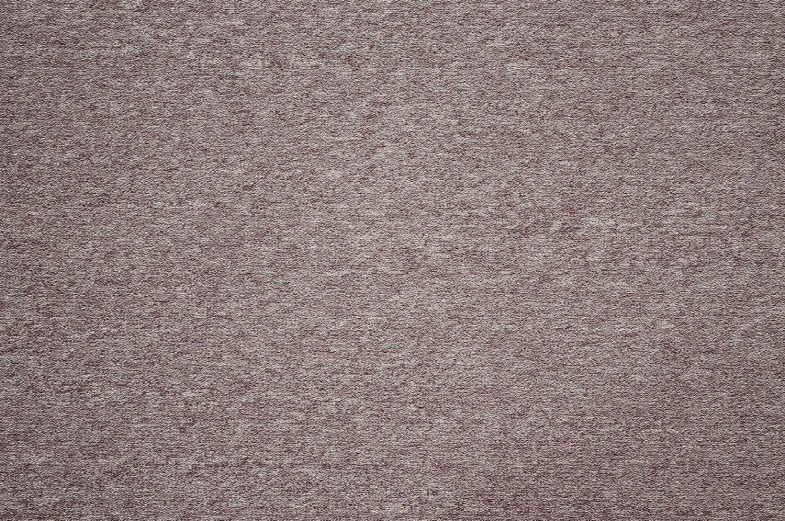 a white carpet with some spots on it