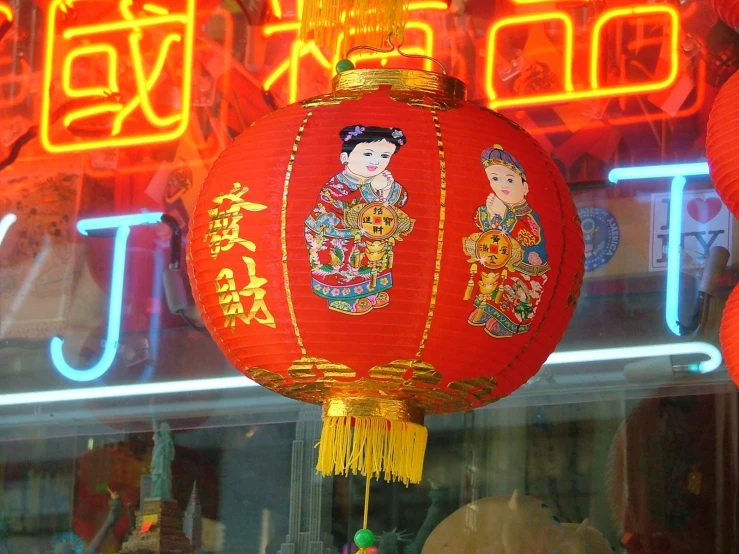 red lanterns in the front window of a shop