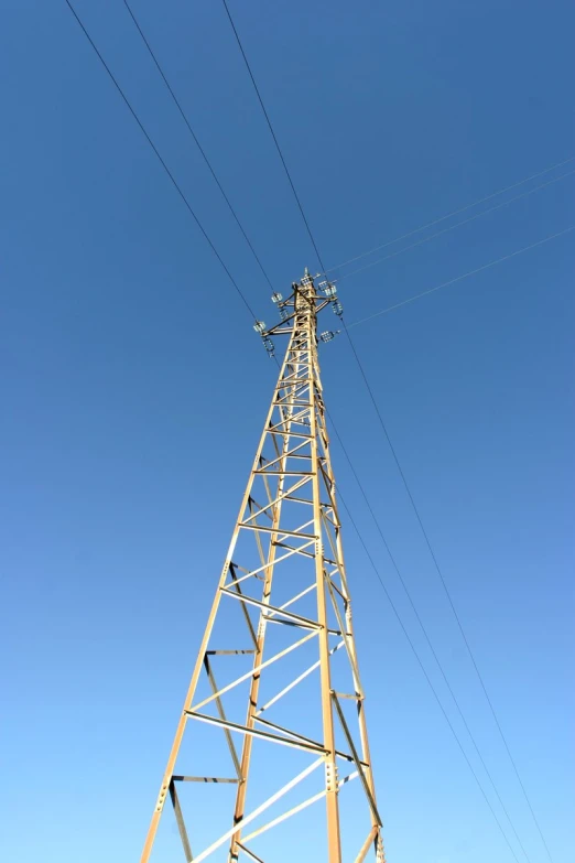 a tall tower next to many power lines