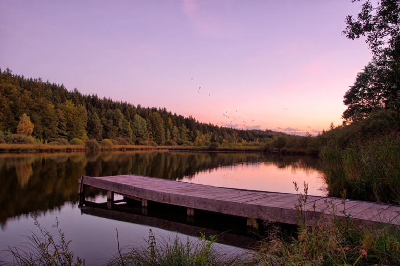 a body of water that has a dock on it