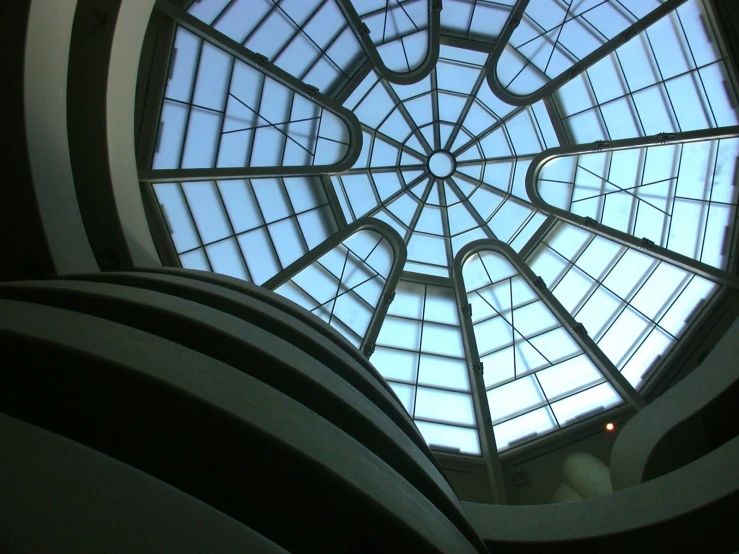 a large round window looks up at the sky