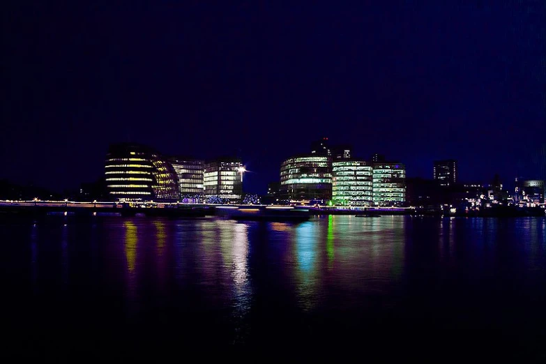 some buildings in a city at night