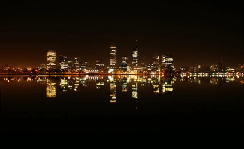 a city is seen with lights from the building