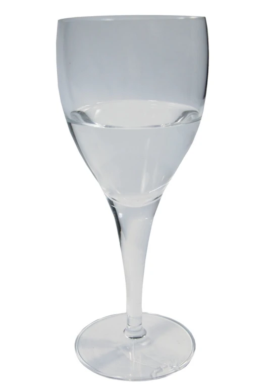 a glass of wine on a white surface