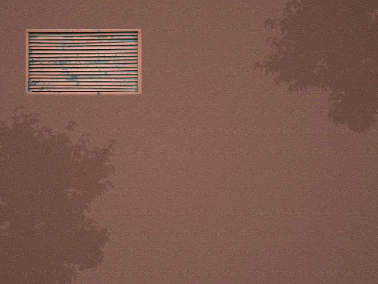 there is a brown color with vertical blinds on the top