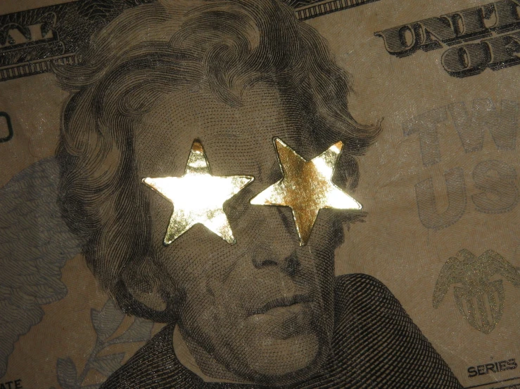 two stars are positioned between the one dollar bill