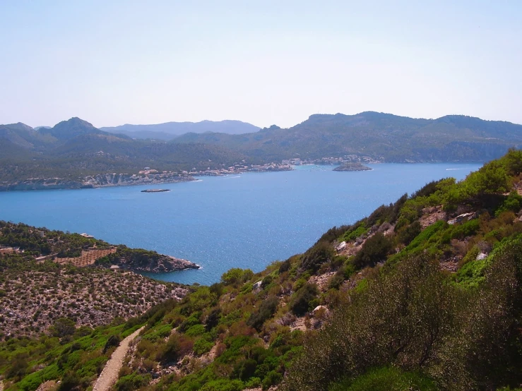 a mountain view looking down at the ocean and hills