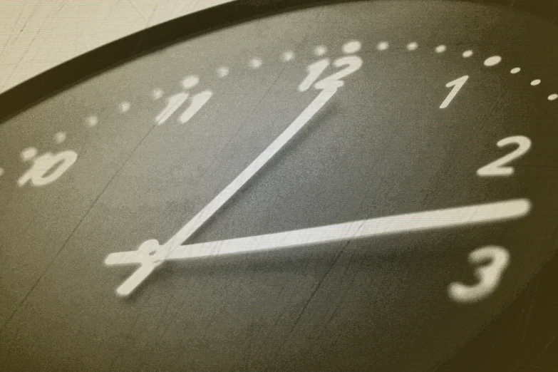 a close up po of a clock that is showing the time to twelve