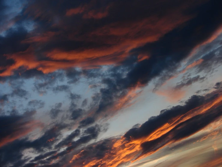 a blue sky with red clouds at sunset