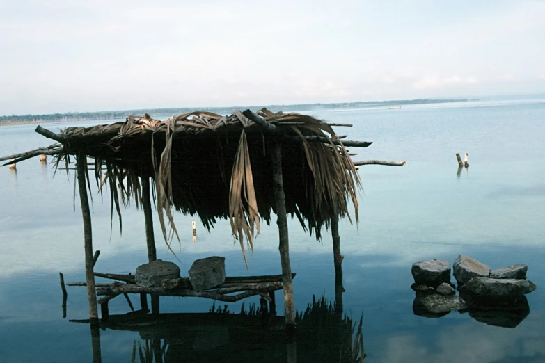 a hut that is sitting on the beach