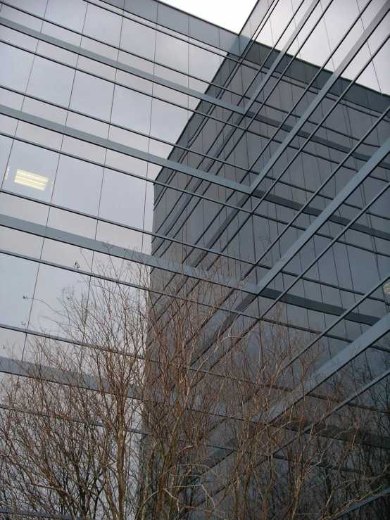 a building made of glass and metal on top