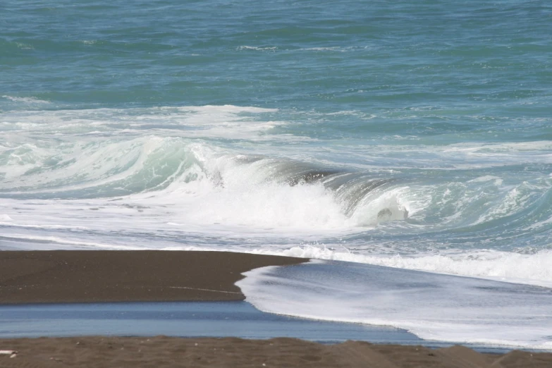 a wave that has fallen into the ocean