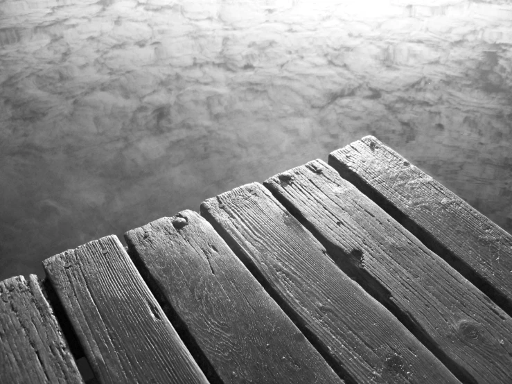 the wooden walkway runs into the water