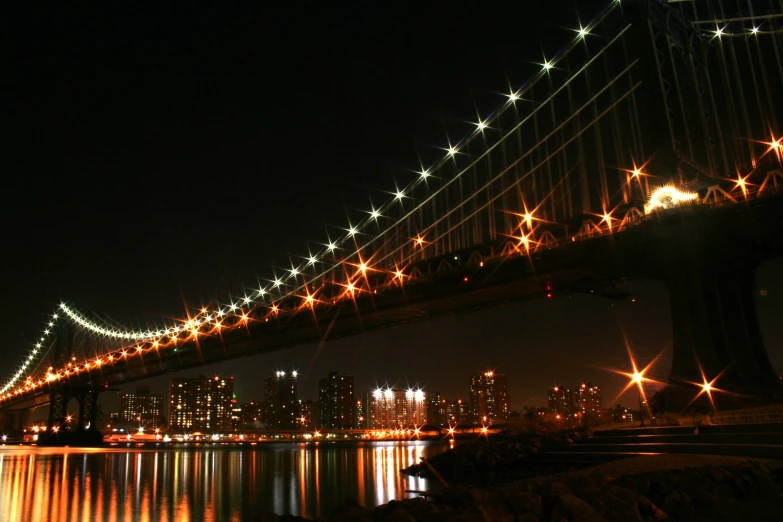 a bridge with bright lights in the dark